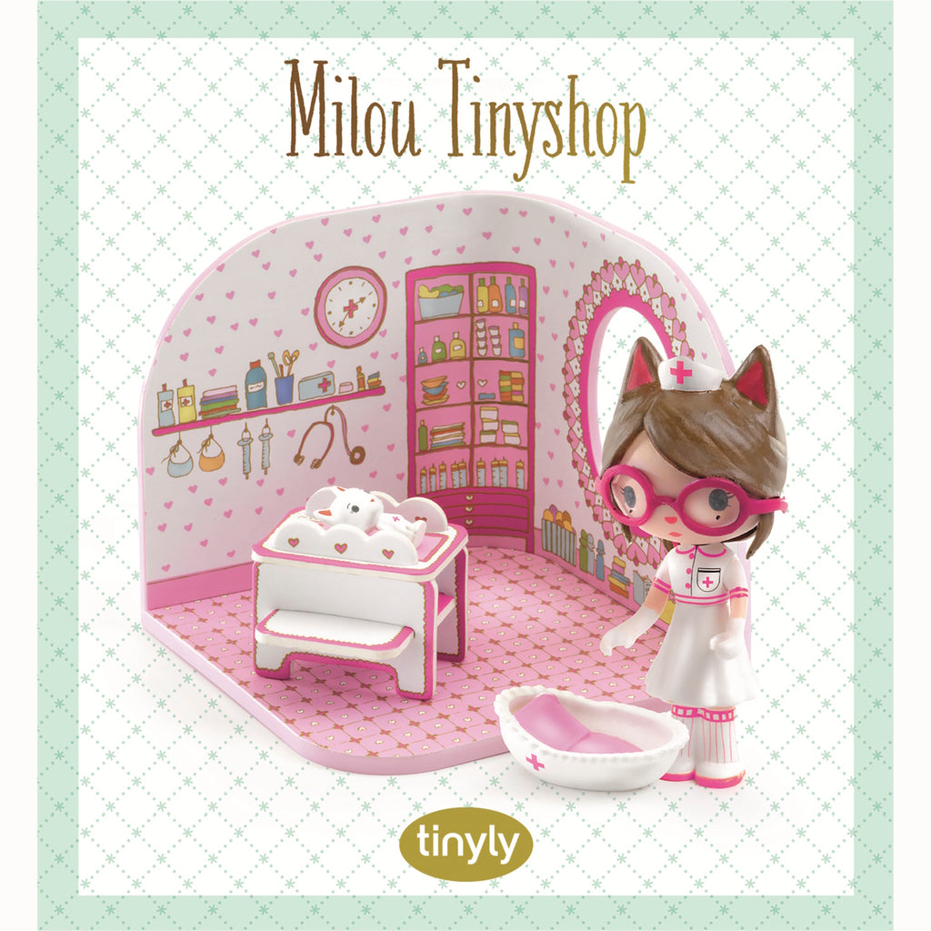 A playful scene featuring a nurse doll with cat ears, a white kitten, and a colorful, heart-themed room with shelves and toys.