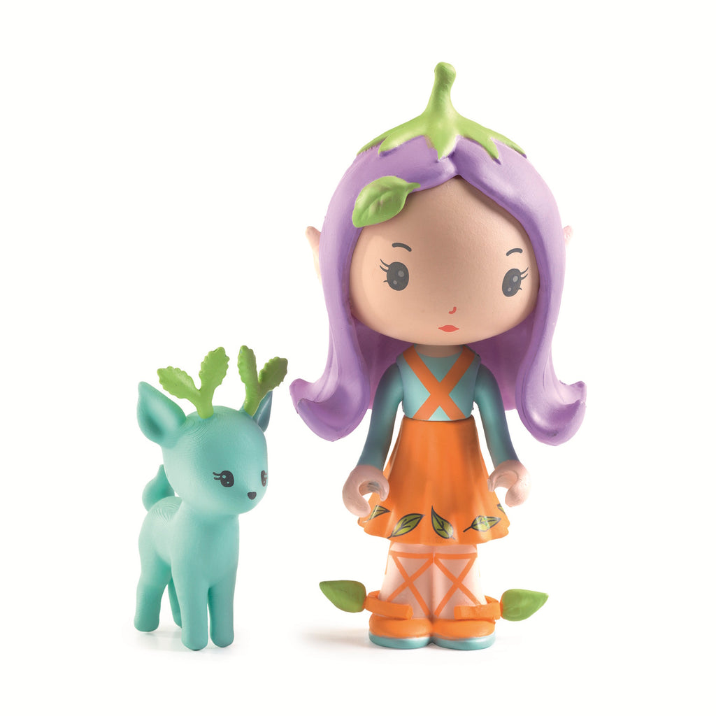 A colorful mushroom-shaped house with a doll peeking out, surrounded by a whimsical, illustrated landscape and a green toy deer. 