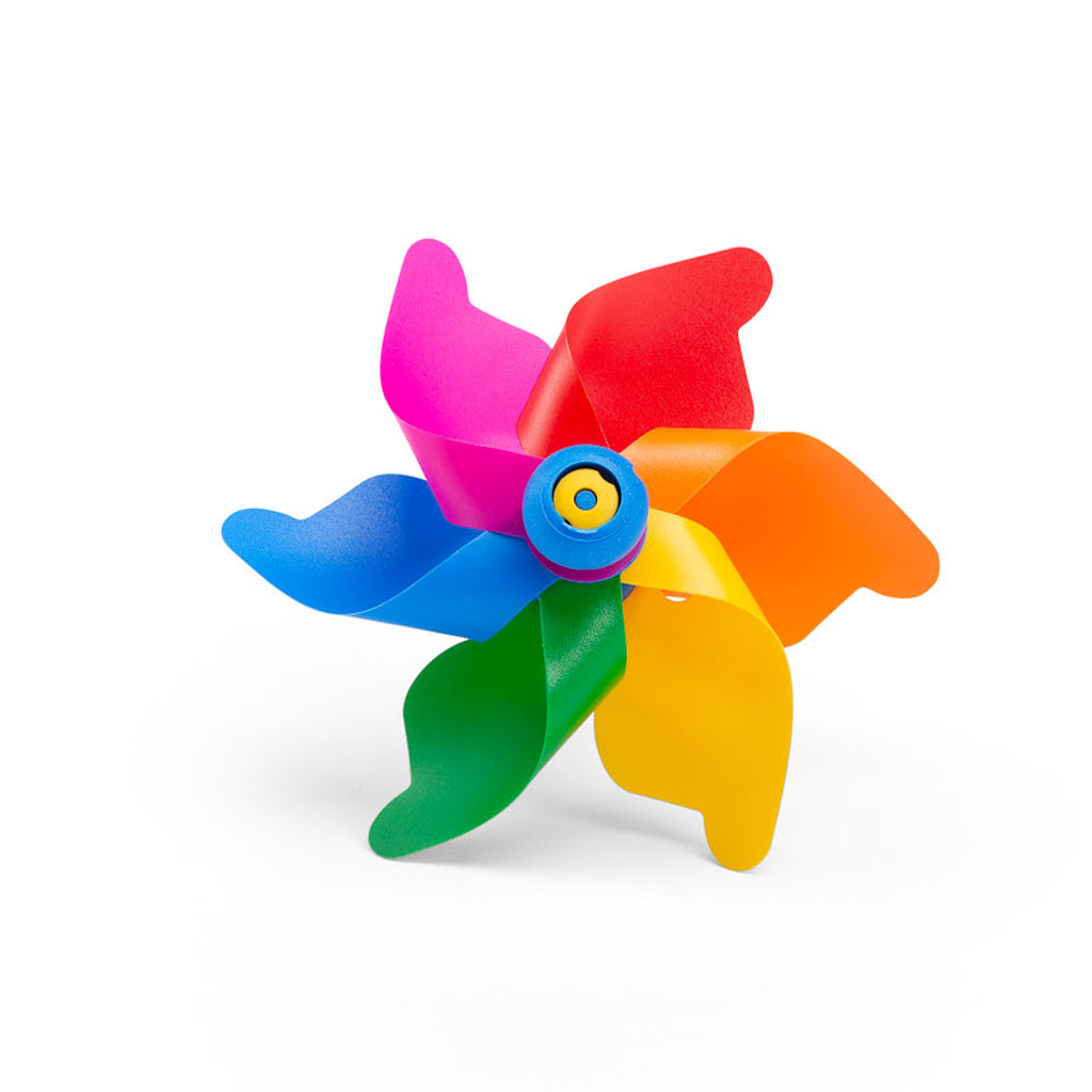 A colorful toy pinwheel with six vibrant blades in pink, red, orange, yellow, green, and blue against a white background, conveying a playful tone.