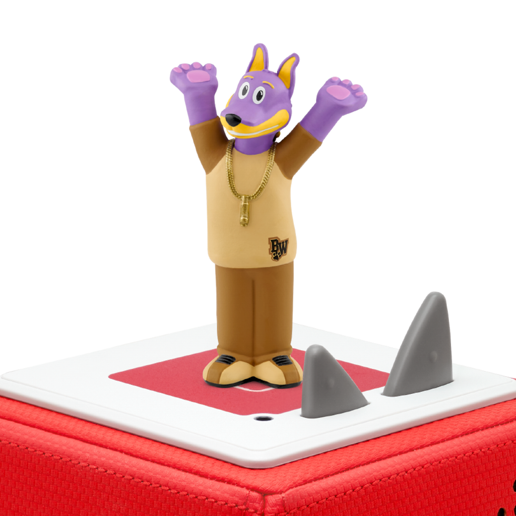 A purple cartoon wolf figure with raised arms, wearing a tan shirt and gold chain, stands on a red and white platform. The background is white.