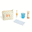 Kids rabbit-themed dental hygiene travel kit with polka dot pouch, toothbrush, rinse cup, and toy toothpaste.
