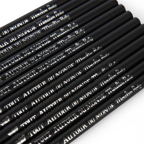 Close-up of black Moulin Roty Tout Autour du Monde pencils featuring silver foil lettering and butterfly logo.