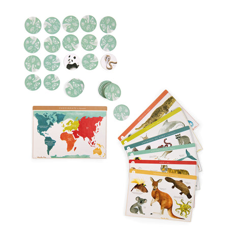 Moulin Roty Animal Lotto game pieces, including a colorful world map, animal tokens, and continent-themed bingo boards.