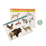 Moulin Roty animal lotto game boards for Africa, Europe, and North America with watercolor illustrations of wildlife.