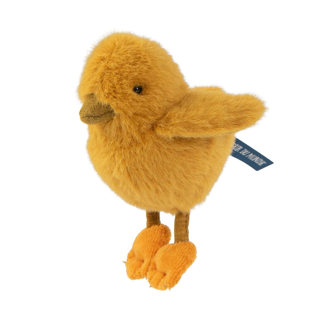 Yellow fuzzy chick stuffed animal by Moulin Roty, Tout Autour du Monde collection, with orange feet on white background.