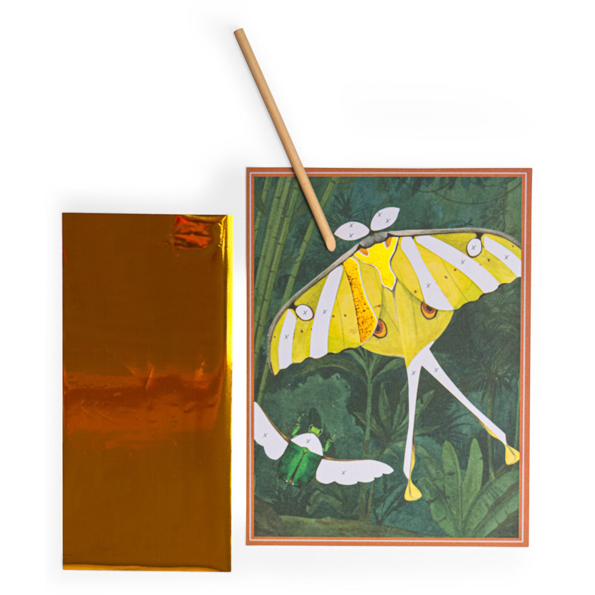 Child using a wooden tool to apply gold foil to a yellow butterfly and green beetle on a Moulin Roty art board.