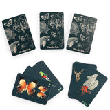 Moulin Roty Tout Autour du Monde animal seek and find card game with illustrated butterflies, squid, and deer.