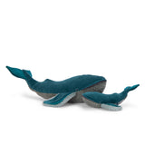Two plush whale toys, one large and one small, in teal velvet and grey textured fabric from the Tout Autour Du Monde collection.