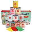 Stacked vintage game tin cans and colored bean bags positioned in front of their product box.