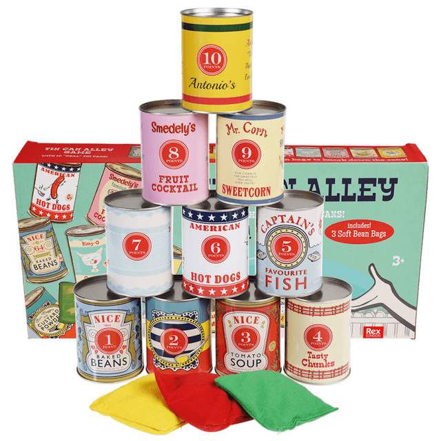 Stacked vintage game tin cans and colored bean bags positioned in front of their product box.