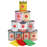 Stacked numbered game tin cans in a pyramid shape with three colored bean bags in front.