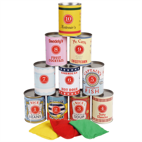 Stacked numbered game tin cans in a pyramid shape with three colored bean bags in front.
