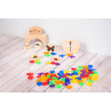 A set of colorful, see-through plastic bug figures designed for sensory play, sorting, counting, and light table exploration.