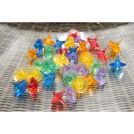 A set of spinning sensory toys with clear, colorful discs that create visual effects, ideal for exploring color mixing and motion.