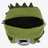 Top view of an open green dinosaur backpack with white speckles, dark felt spikes, and a grey handle.