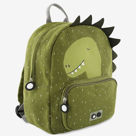 A green children's backpack featuring a dinosaur graphic, fabric spikes along the side, and a front pocket.
