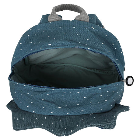 Open blue speckled triceratops backpack showing the empty main compartment and a grey top handle.