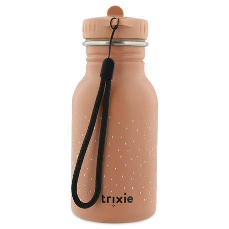 The back of a peach kids' water bottle with white specks, a black wrist strap, and the "trixie" logo.