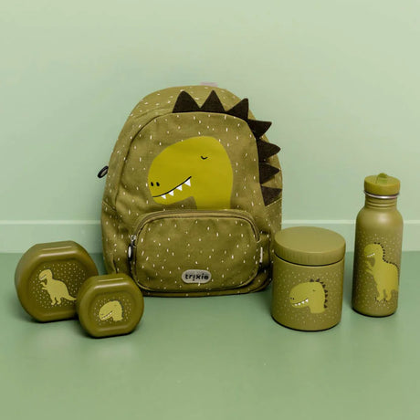 A matching green dinosaur-themed school set including a backpack, water bottle, food jar, and snack boxes.