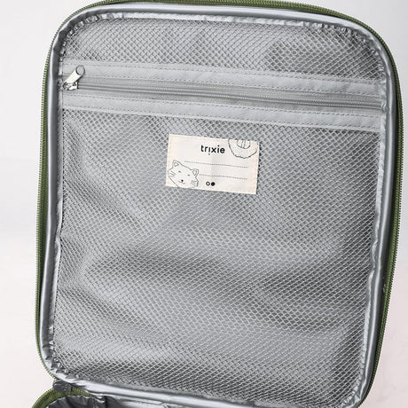 Close-up of the inside flap of a lunch bag, featuring a zippered grey mesh pocket and a name label.