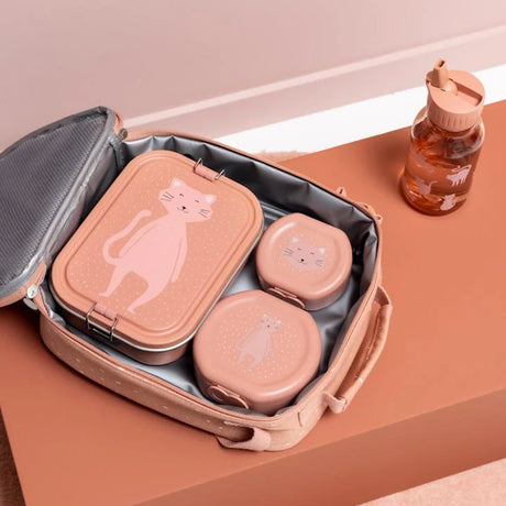 An open pink lunch bag filled with three pink cat-themed lunch containers next to a matching water bottle.