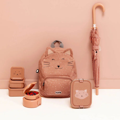 Collection of pink cat-themed school gear, featuring a backpack, lunch boxes, snack containers, and an umbrella.
