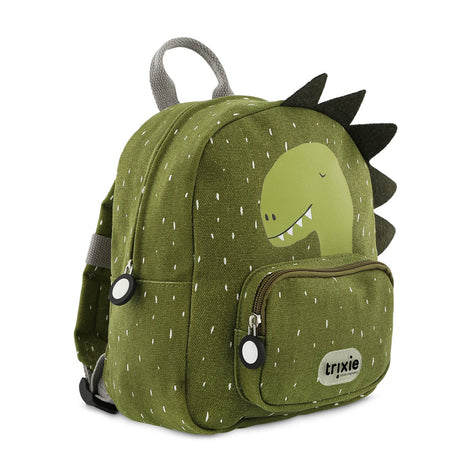 A green dinosaur backpack with white speckles, dark felt spikes, a printed dinosaur graphic, and front pocket.
