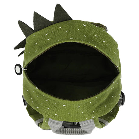 An open, green children's backpack with a white speckled pattern, grey handle, and fabric dinosaur spikes.