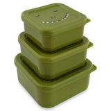 Three green square dinosaur-themed snack boxes stacked on top of each other, on a white background.