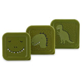 A set of three nesting green snack boxes in graduating sizes, each featuring a different dinosaur design.