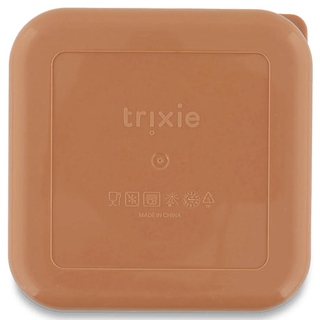 The back of a square, peach snack box with rounded corners and an embossed Trixie logo.