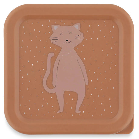 Top-down view of a square pink snack box lid featuring a cute cartoon cat illustration with white specks.