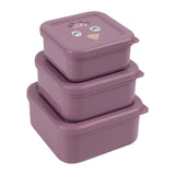 Three purple, square nesting snack boxes stacked on top of each other, with a peacock face on the top lid.