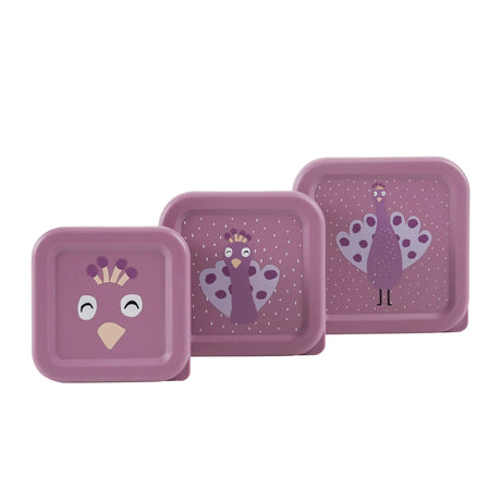 Three nesting purple snack boxes with a cute cartoon peacock design on the lids.