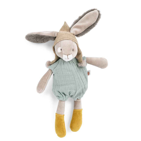 Plush rabbit toy wearing a tan pointed hood, a sage green romper, and yellow socks against a white background.
