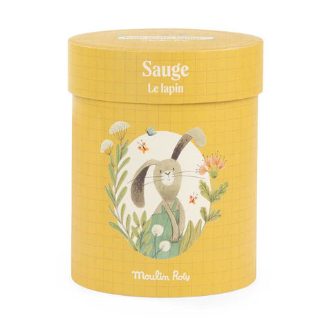 Yellow cylindrical box featuring an illustration of a rabbit, flowers, and butterflies by Moulin Roty.