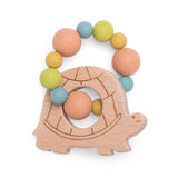 Wooden turtle-shaped teething toy with a ring of colorful silicone beads in blue, green, yellow, and peach.