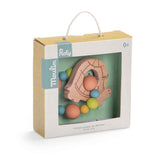 Packaged Moulin Roty wooden turtle teether rattle with colorful beads, viewed from a slight angle.