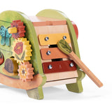 Trois Petits Lapins wooden turtle activity toy featuring a built-in xylophone and gears.