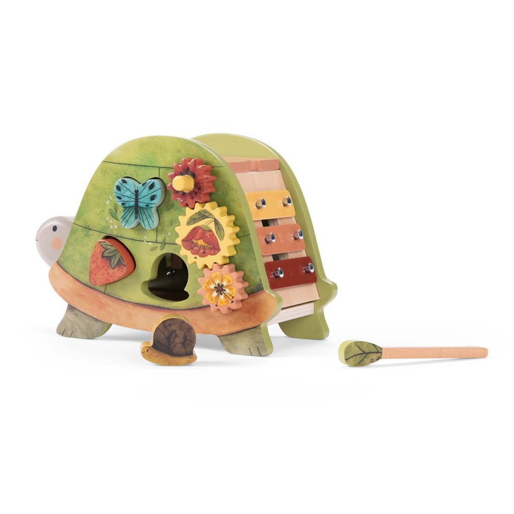 Colorful wooden activity toy featuring a xylophone with a leafy mallet, spinning gears, and nature-themed designs. Playful and educational tone.