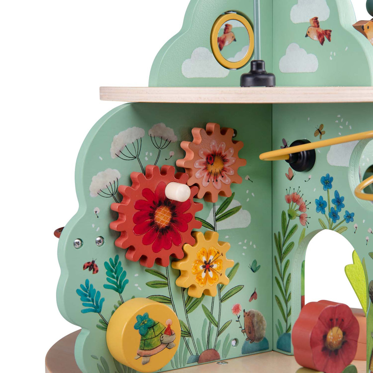 Close up of Moulin Roty Trois Petits Lapins wooden activity toy gears and flowers.