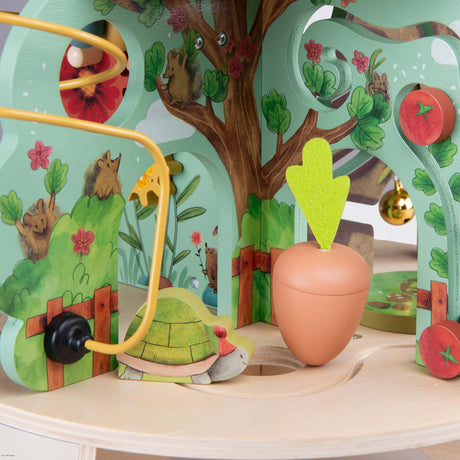 Trois Petits Lapins wooden multi activity garden toy with turtle bead maze and carrot sorting game.