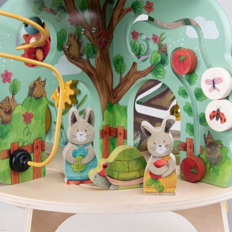 Trois Petits Lapins wooden multi-activity garden toy with rabbit and turtle figures.