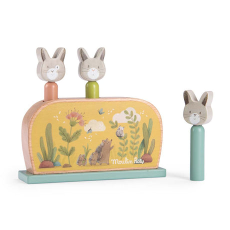 Moulin Roty Trois Petits Lapins wooden pop up toy with three cute rabbit pegs.