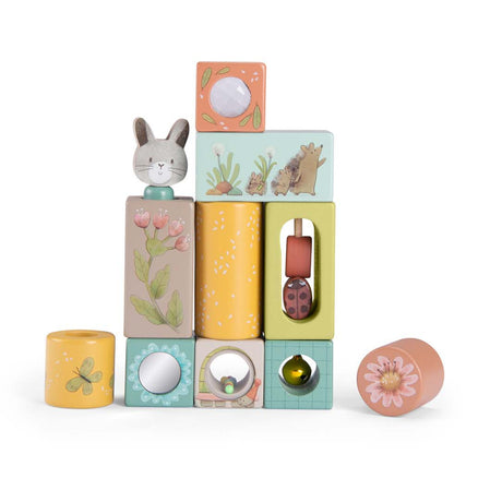 Trois Petits Lapins wooden stacking activity blocks with rabbit and nature illustrations.