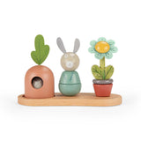 Moulin Roty Trois Petits Lapins wooden stacking toy with a carrot bunny and flower.