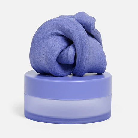 Swirled periwinkle-blue focus putty sitting on top of its matching circular container.