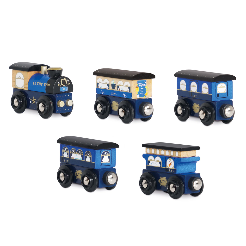 Five blue and grey wooden toy train cars are shown. Each has distinct window designs and black wheels, conveying a playful and vintage vibe.