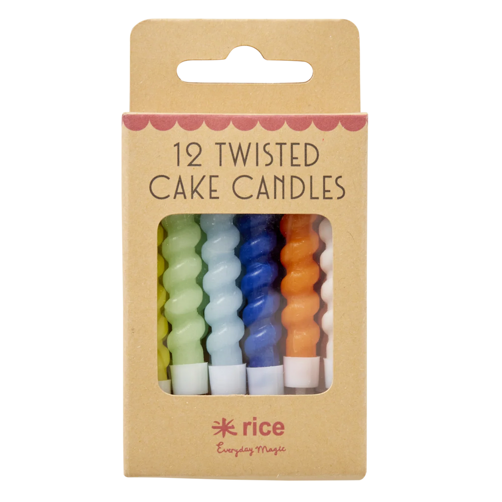 A set of colorful twisted cake candles in blue, green, yellow, orange, and white are visible through a cardboard box with "12 Twisted Cake Candles" text.
