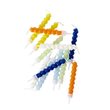 Brightly colored spiral candles in hues of blue, orange, yellow, and white are scattered on a white background, creating a playful and vibrant look.